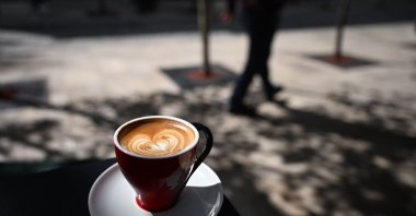 A macchiato coffee at a terrace table of a coffee shop, Pristina, Kosovo, Sept. 12, 2025. (AFP Photo)