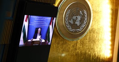 Palestinian Authority President Mahmud Abbas is displayed on a screen as he speaks remotely during a United Nations Summit on Palestinians at U.N. headquarters during the United Nations General Assembly (UNGA) in New York, Sept. 22, 2025. (AFP Photo)