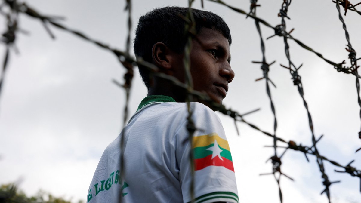 A Rohingya boy looks on through the barbed wire fence at a refugee camp, Cox&#039;s Bazar, Bangladesh, Aug. 25, 2025. (Reuters Photo)