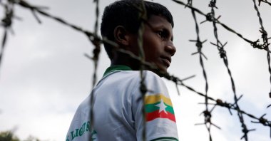 A Rohingya boy looks on through the barbed wire fence at a refugee camp, Cox&#039;s Bazar, Bangladesh, Aug. 25, 2025. (Reuters Photo)