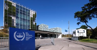 People stand outside the International Criminal Court (ICC), in The Hague, Netherlands, Sept. 22, 2025. (Reuters Photo)