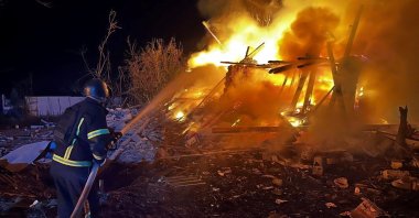 A firefighter works at the site of buildings hit during the Russian airstrike, in Zaporizhzhia, Ukraine, Sept. 23, 2025. (Reuters Photo)