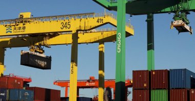 A gantry crane lifts a container at a port, Tianjin, China, Feb. 8, 2025. (Reuters Photo)