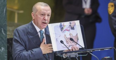 President of the Republic of Türkiye Recep Tayyip Erdoğan holds a photo showing a malnourished child in the Gaza Strip, as he speaks during the General Debate of the 80th session of the United Nations General Assembly (UNGA) at the United Nations headquarters in New York, Sept. 23, 2025. (EPA Photo)