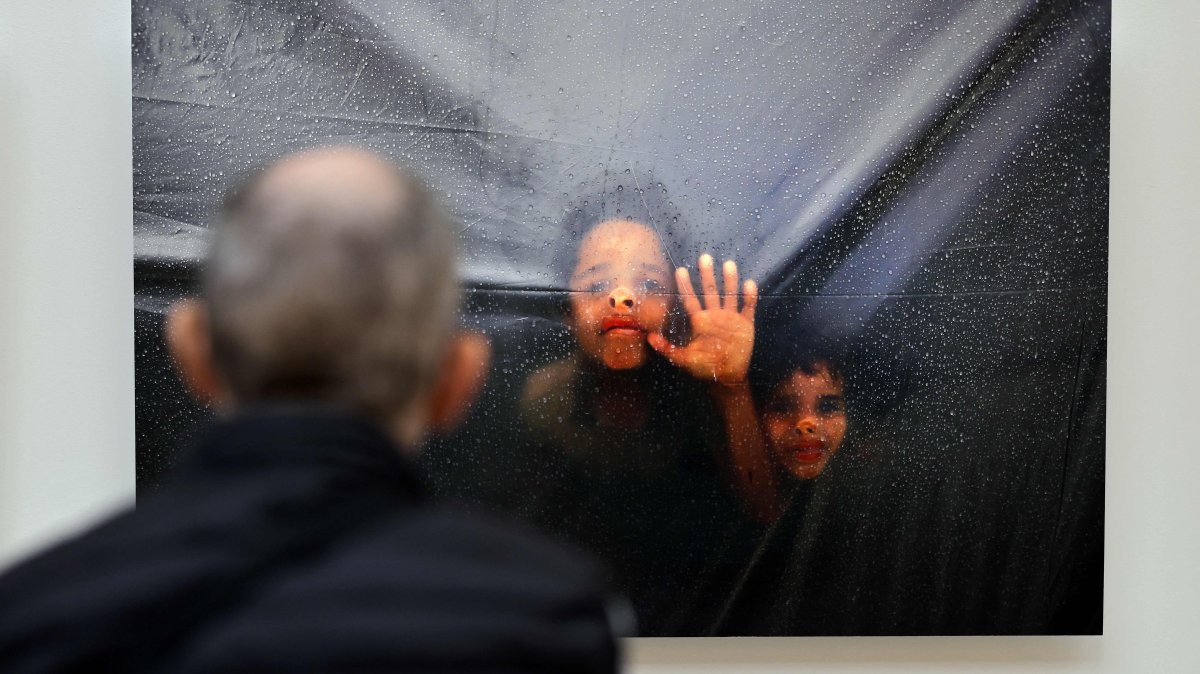 A visitor attends a photography exhibition entitled &quot;Gaza Through Their Eyes&quot; at the Thyssen-Bornemisza museum, Madrid, Spain, Sept. 23, 2025. (AFP Photo)