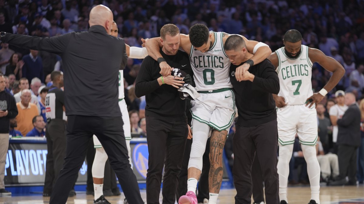 Trainers help Boston Celtics&#039; Jayson Tatum off the court after he was injured during the second half of Game 4 in the Eastern Conference semifinals of the NBA basketball playoffs against the New York Knicks, New York, U.S., May 12, 2025. (AP Photo)