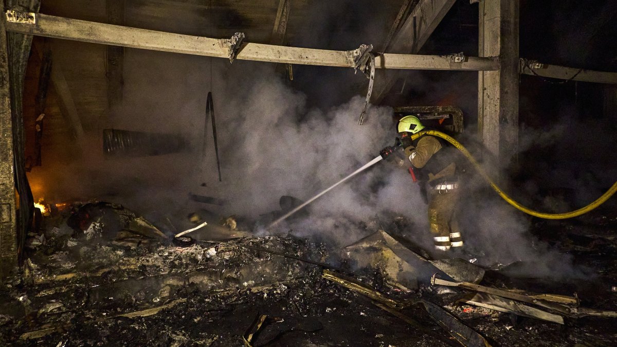 Ukrainian rescuers work at the site of shelling in Kharkiv, northeastern Ukraine, Sept. 23, 2025. (EPA Photo)