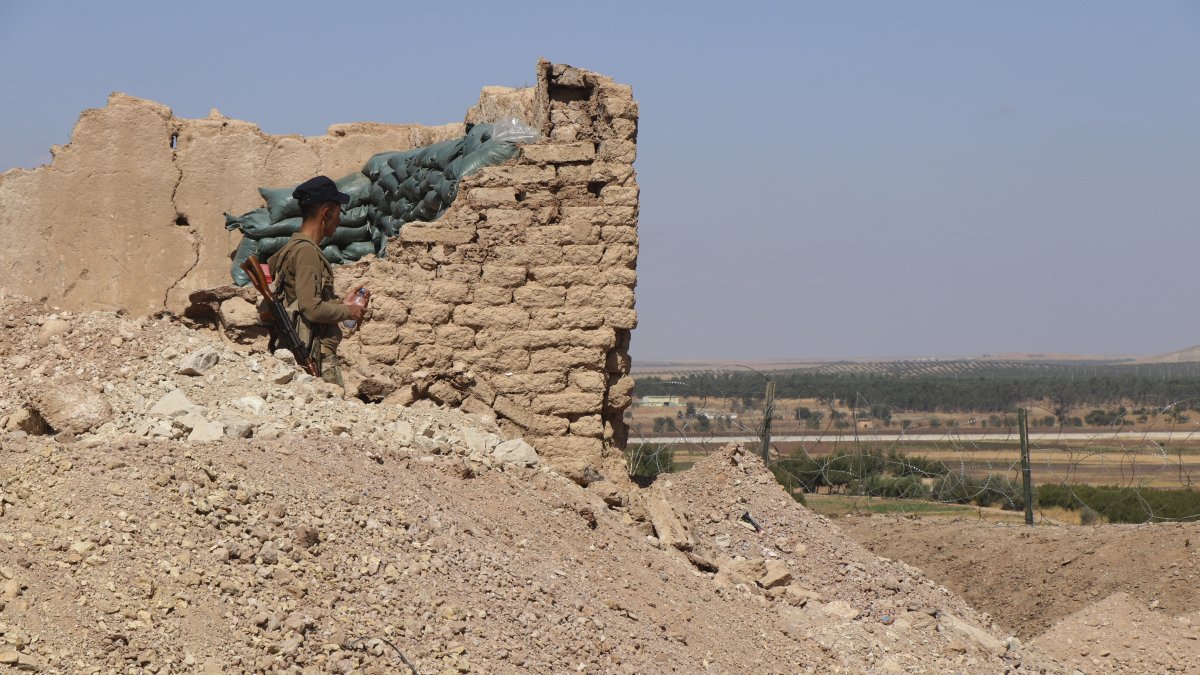 A YPG member stands inside a post, Tal Abyad, Syria, Oct. 7, 2019. (AP Photo)