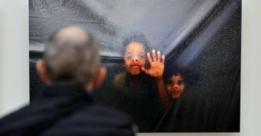 A visitor attends a photography exhibition entitled &quot;Gaza Through Their Eyes&quot; at the Thyssen-Bornemisza museum, Madrid, Spain, Sept. 23, 2025. (AFP Photo)