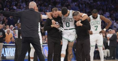 Trainers help Boston Celtics&#039; Jayson Tatum off the court after he was injured during the second half of Game 4 in the Eastern Conference semifinals of the NBA basketball playoffs against the New York Knicks, New York, U.S., May 12, 2025. (AP Photo)
