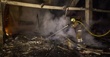 Ukrainian rescuers work at the site of shelling in Kharkiv, northeastern Ukraine, Sept. 23, 2025. (EPA Photo)