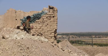 A YPG member stands inside a post, Tal Abyad, Syria, Oct. 7, 2019. (AP Photo)
