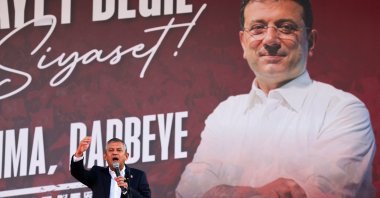 Main opposition Republican People&#039;s Party (CHP) Chairperson Özgür Özel, with a banner featuring jailed Istanbul Mayor Ekrem Imamoğlu in the background, addresses a rally, Ankara, Türkiye, Sept. 14, 2025. (Reuters Photo)