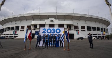 Government sports officials pose for photos outside the National Stadium after the opening ceremony for the creation of &quot;Corporation Juntos 2030,&quot; Santiago, Chile, Nov. 11, 2022. (AP Photo)