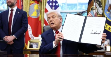 U.S. President Donald Trump shows a signed executive order on a deal that would divest TikTok&#039;s U.S. operations from its Chinese owner, ByteDance, at the White House, Washington, D.C., U.S., Sept. 25, 2025. (Reuters Photo)