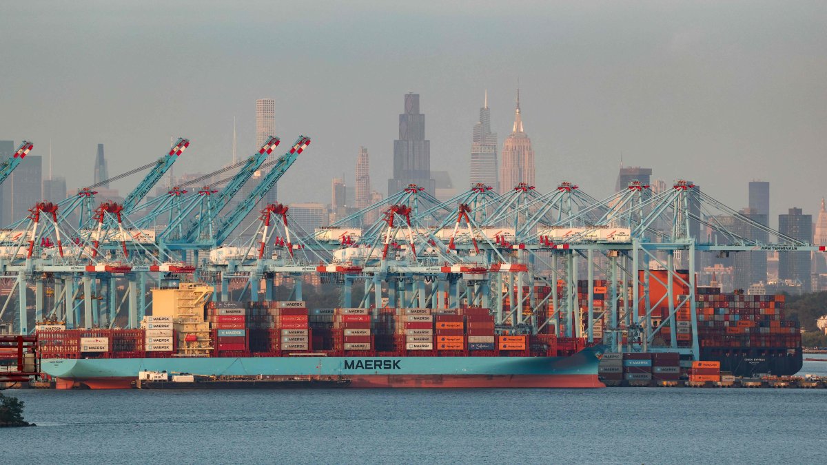 Cargo ships and shipping containers are seen at the Port Jersey Container Terminal, with the Manhattan skyline in the distance, in Jersey City, New Jersey, U.S., Sept. 22, 2025. (AFP Photo)