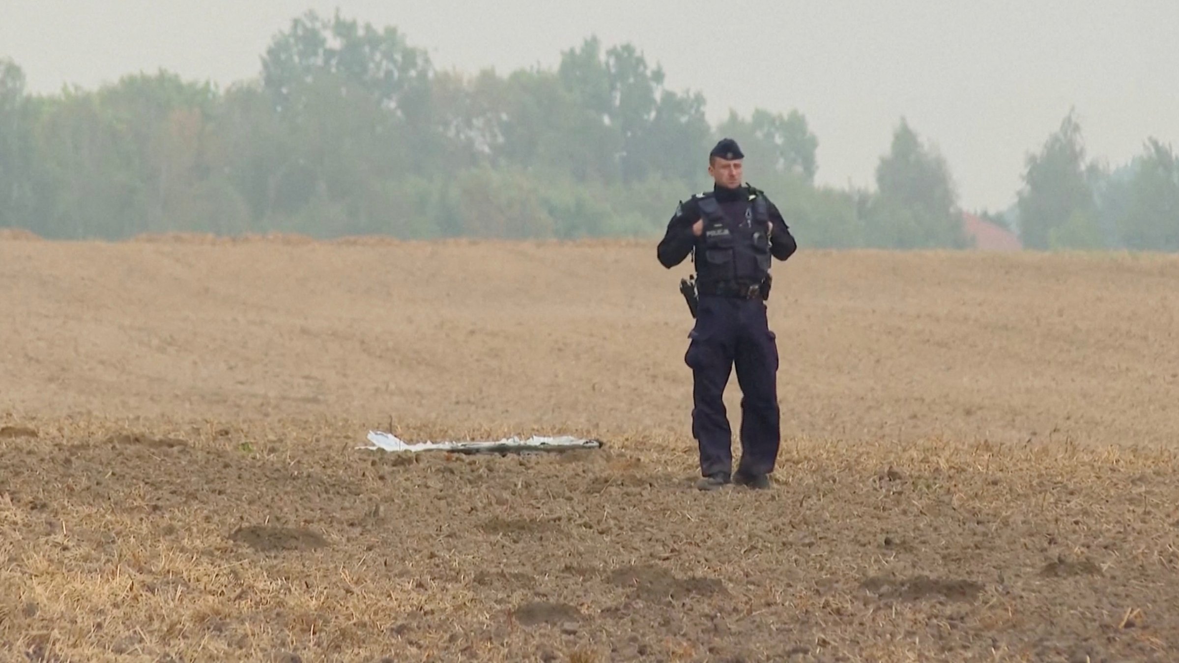 In this still image from a video, a Polish police officer stands near an UAV fragment, after Russian drones violated Polish airspace during an attack on Ukraine, Czesniki, Lublin, Poland, Sept. 10, 2025. (Reuters Photo)