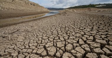 Cracks appear after a large portion of the Abrash Dam dries up in the Tartous countryside, Syria, Sept. 9, 2025. (EPA Photo)