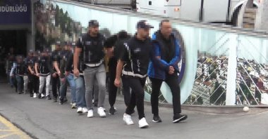 Police detain suspects in a nationwide operation targeting an organized crime ring involved in illegal citizenship schemes, Istanbul, Türkiye, Sept. 25, 2025. (DHA Photo) 