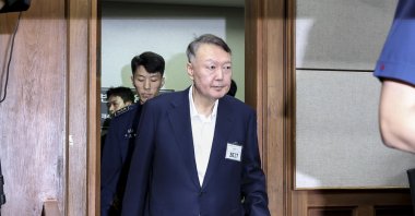 Former President Yoon Suk Yeol enters a courtroom at the Seoul Central District Court to attend the first hearing of his second trial on martial law-related charges, appearing in public for the first time since he was placed under arrest, Seoul, South Korea, Sept. 26, 2025.  (EPA Photo)