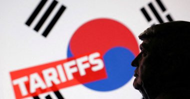 A 3D-printed miniature model of U.S. President Donald Trump, the South Korean flag and the word &quot;Tariffs&quot; are seen in this illustration taken on July 23, 2025. (Reuters Photo)