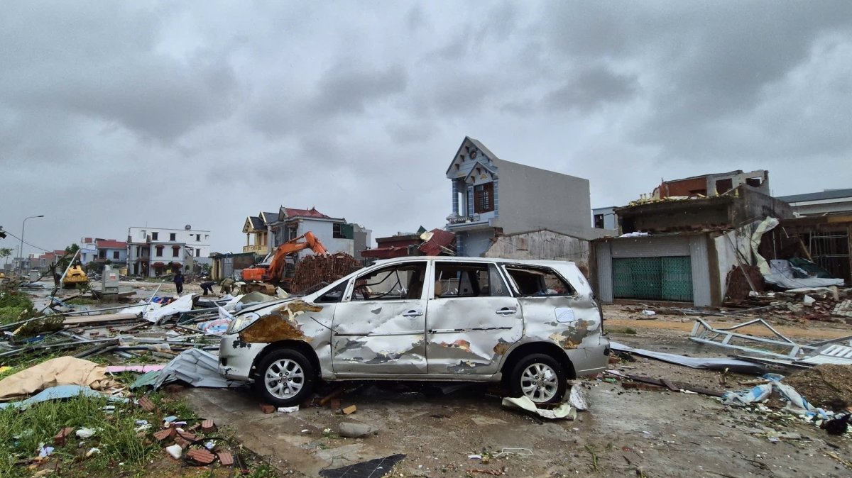 A damaged car is seen amid debris and other damaged buildings after Typhoon Bualoi swept through Thanh Hoa, Vietnam, Sept. 29, 2025. (AP Photo)