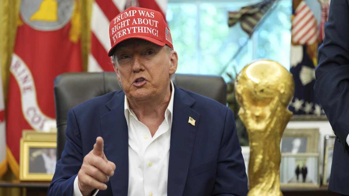 President Donald Trump speaks alongside the FIFA World Cup Winners Trophy in the Oval Office of the White House, Washington, U.S., Aug. 22, 2025. (AP Photo)