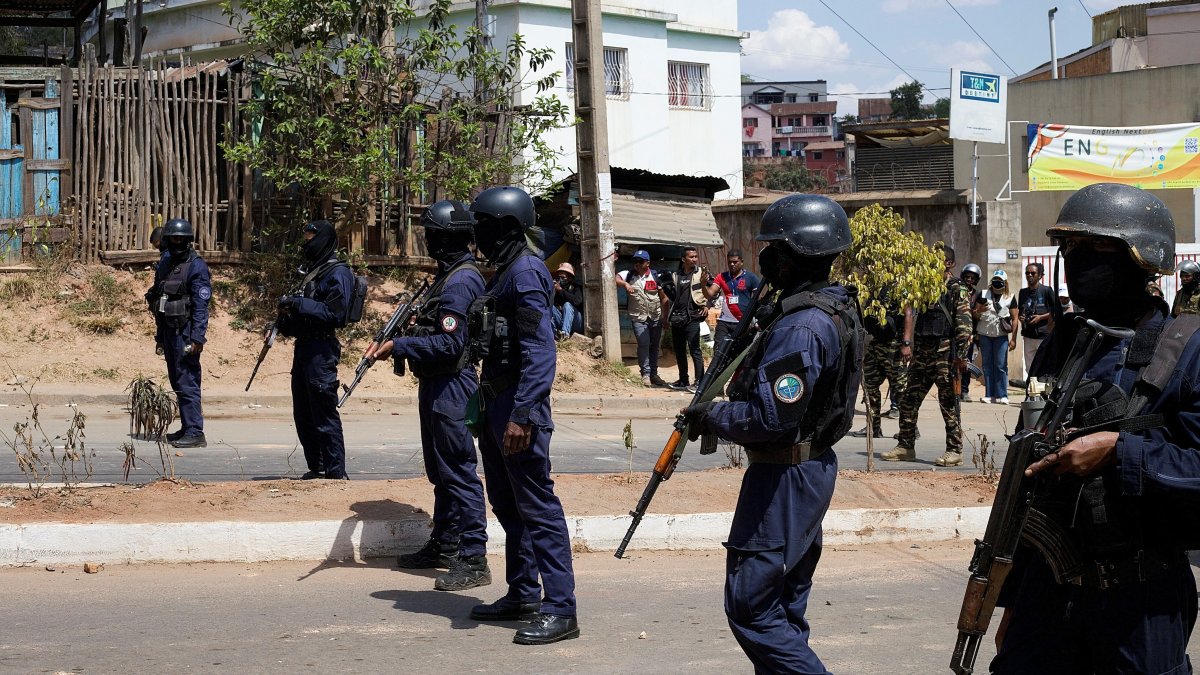 Malagasy riot police personnel stand in a formation to disperse protesters during a demonstration against frequent power outages and water shortages, near the University of Antananarivo, Madagascar, Sept. 29, 2025. (Reuters Photo)