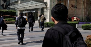 Commuters walk after exiting a metro station at the Lujiazui financial district in Shanghai, China, April 8, 2025. (Reuters Photo)