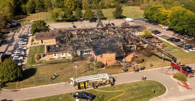 Emergency crews respond to a shooting and fire at The Church of Jesus Christ of Latter-day Saints, in Grand Blanc, Michigan, U.S., Sept. 28, 2025. (AP Photo)