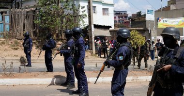 Malagasy riot police personnel stand in a formation to disperse protesters during a demonstration against frequent power outages and water shortages, near the University of Antananarivo, Madagascar, Sept. 29, 2025. (Reuters Photo)