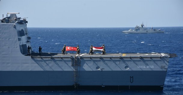 Turkish and Egyptian naval personnel display their national flags aboard a ship during the “Friendship Sea 2025” exercise, Muğla, Türkiye, Sept. 25, 2025. (AA Photo)