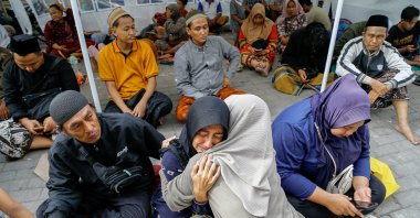 A relative of a victim of a collapsed building reacts, after a hall collapsed while students were praying at the Al-Khoziny Islamic boarding school in Sidoarjo, East Java, Indonesia, Sept. 30, 2025. (Reuters Photo)