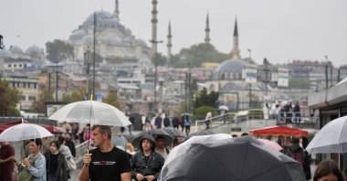 People walk on a rainy day in Istanbul, Türkiye, Sept. 6, 2025. (AA Photo)