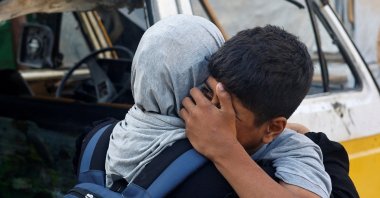Mourners react during the funeral of Palestinians, who, according to medics, were killed in overnight Israeli strikes, at al-Awda Hospital in the central Gaza Strip, Palestine, Sept. 28, 2025. (Reuters Photo)