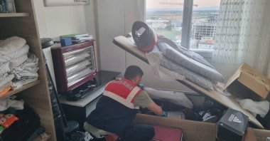 This undated photo provided by security forces shows a gendarmerie officer searching a raided location. (DHA Photo)