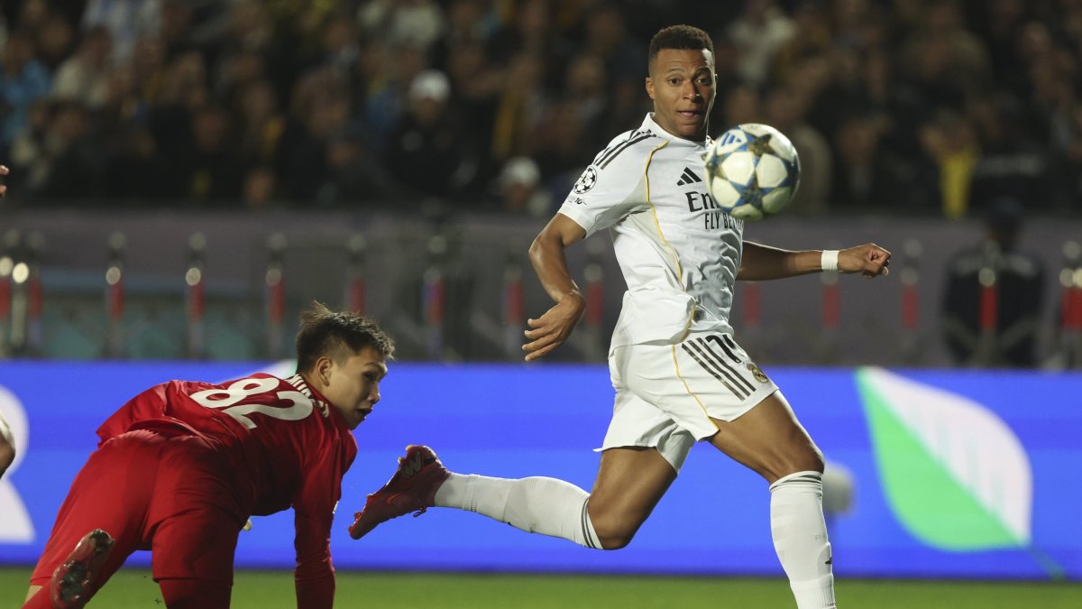 Real Madrid&#039;s Kylian Mbappe scores the 0-2 goal against goalkeeper Sherhan Kalmurza (L) of Kairat Almaty during the UEFA Champions League match, Almaty, Kazakhstan, Sept. 30, 2025. (EPA Photo)