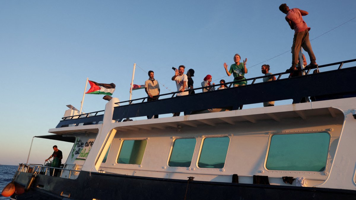 FILE PHOTO: Greta Thunberg and members of the crew react aboard a ship, part of the Global Sumud Flotilla aiming to reach Gaza and break Israel's naval blockade, as they sail off Crete island, Greece, September 25, 2025. REUTERS/Stefanos Rapanis/File Photo