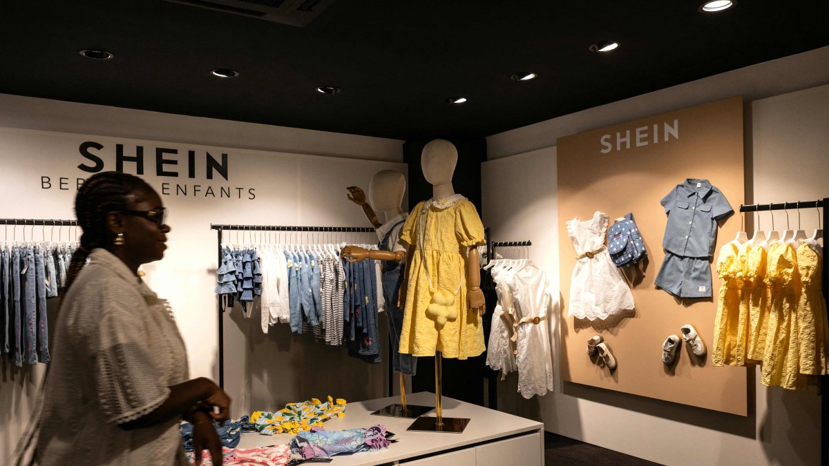 A customer walks in a pop-up store of the Chinese-founded fast fashion brand Shein, in Dijon, June 26, 2025. (AFP Photo)