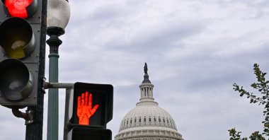 Traffic lights are seen in front of the US Capitol dome in Washington, DC, U.S., Sept. 30, 2025. (AFP Photo)