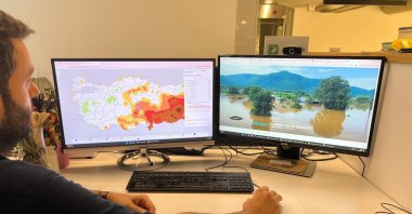 Güven Fidan reviews the country’s interactive drought map on computer screens, showing provincial and district-level data from 1990 to 2025, Istanbul, Türkiye, Oct. 1, 2025. (AA Photo)