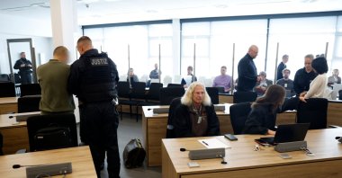 The two defendants (Jian G at L and Yaqi X at R) are being uncuffed as they arrive at a room of the higher regional court in Dresden, eastern Germany, Sept. 30, 2025. (AFP Photo)