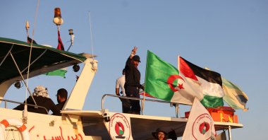 Crew interacts from aboard a boat, part of the Global Sumud Flotilla aiming to reach Gaza and break Israel's naval blockade, as it sails off Koufonisi islet, Greece, Sept. 26, 2025. (Reuters File Photo)