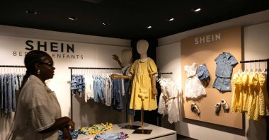A customer walks in a pop-up store of the Chinese-founded fast fashion brand Shein, in Dijon, June 26, 2025. (AFP Photo)