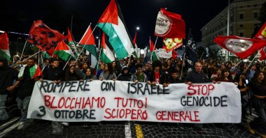 Pro-Palestinian demonstrators carry a banner calling for a general strike on October 3rd at a protest to condemn Israel&#039;s interception of the vessels of the Global Sumud Flotilla, in Rome, Italy, Oct. 1, 2025. (Reuters Photo)