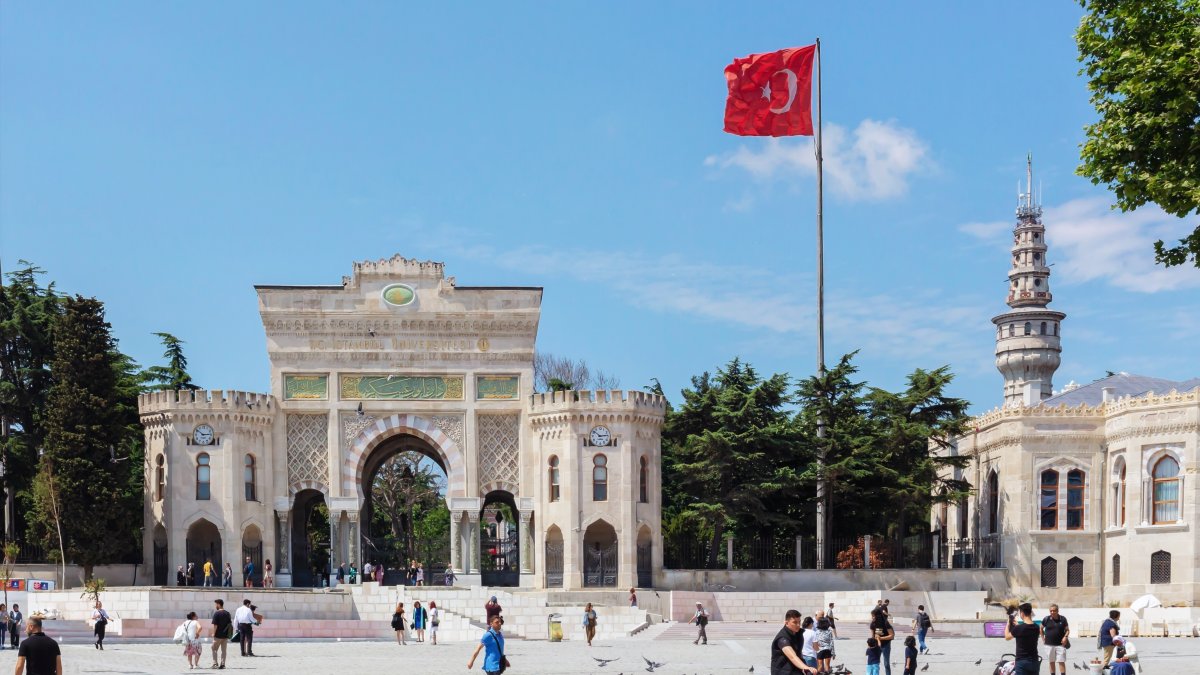 The main entrance gate of Istanbul University in Beyazıt Square with Beyazıt Tower in the background, Istanbul, Türkiye. (Shutterstock Photo)
