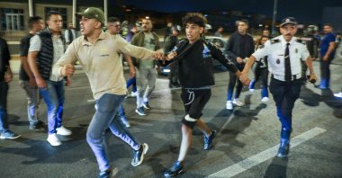 Members of the security forces detain a protester during a youth-led demonstration demanding health care and education reforms, in Sale, Morocco, Oct. 1, 2025. (AFP Photo)