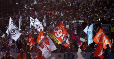 Protesters hold labor union flags during a demonstration in Nantes as part of a day of nationwide strikes and protests against the government and possible austerity cuts, France, Oct. 2, 2025. (Reuters Photo)