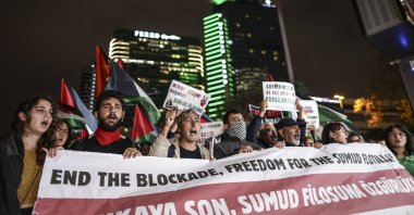 Protesters hold Palestinian flags and shout slogans during a demonstration for Gaza in front of the Israeli Consulate, following the Israeli army's unlawful abduction of Global Sumud Flotilla (GSF) vessels, in Istanbul, Oct. 2, 2025. (EPA Photo)