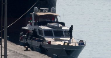 People stand on a boat from a flotilla that had been carrying aid to Gaza until it was intercepted by Israel, docked in the port of Larnaca, Cyprus, Oct. 3, 2025. (Reuters Photo)